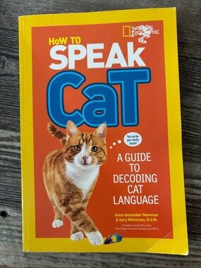 National Geographic Cat Language Guide - Yellow, Orange & Blue Cover